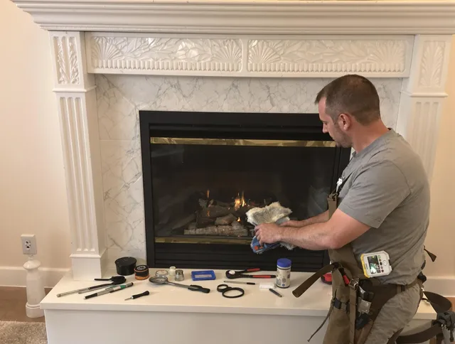 Dartmouth Chimney Sweep performing fireplace maintenance in Dartmouth, MA
