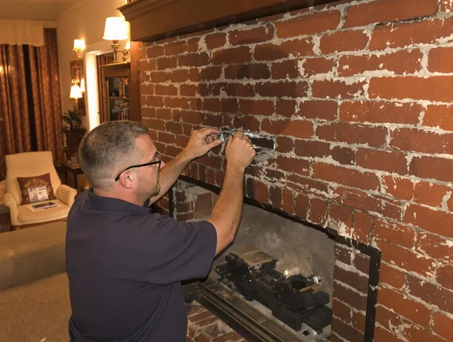 Dartmouth Chimney Sweep expert fixing a fireplace in Dartmouth, MA
